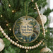 A round ornament hanging on a Christmas tree, featuring a scenic image of a pond and a bird, with the text "Trap Pond State Park, Delaware" displayed prominently.