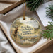 A decorative ornament with a deer and the text "Tule Elk State Natural Reserve, California" on it, placed in a box with pine branches.