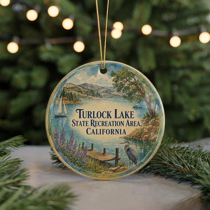 A round ornament with a scenic image of Turlock Lake, the State Recreation Area in California, featuring a boat, dock, and a bird.