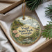 A decorative ornament with a scenic landscape of Vogel State Park, Georgia, featuring a bird, pine trees, and a bridge.