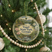 A round ornament on a Christmas tree, featuring a scenic landscape with mountains, pine trees, and a bird, along with the text "Vogel State Park, Georgia".