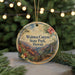 A circular ornament with a scenic image of Waimea Canyon State Park, Hawaii, hanging from a string.