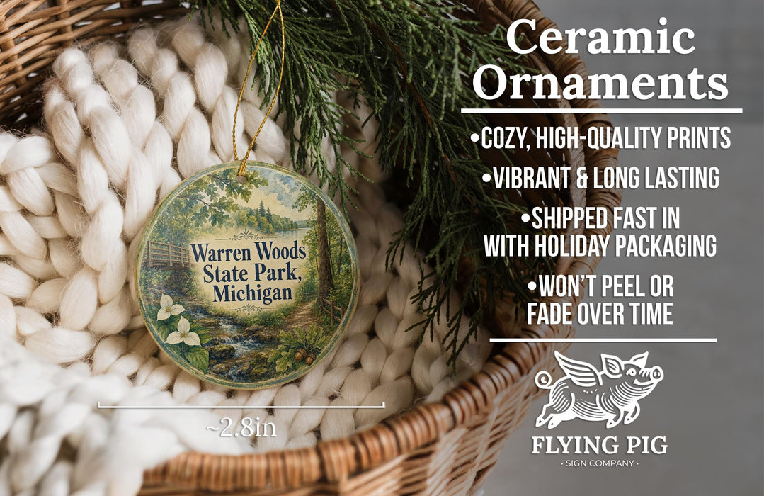 Ceramic ornaments, specifically a ceramic ornament with a design of Warren Woods State Park, Michigan, hanging from a wicker basket.