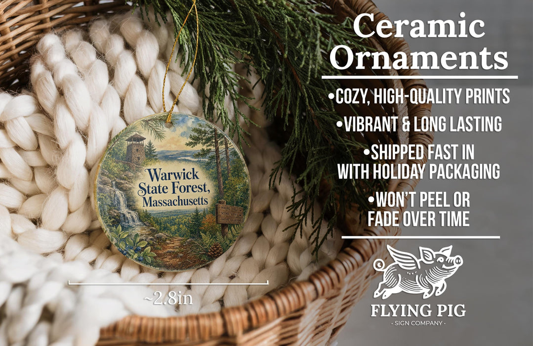 Ceramic ornaments, featuring a painting of a waterfall and pine trees, are displayed in a basket.