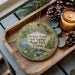 A round ornament with a scenic image of Werner-Boyle Salt Springs State Park, Florida, featuring a beaver, a bird, and a pond.