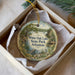 A decorative ornament in a white box, featuring a scenic image of White Oak Lake State Park in Arkansas.