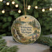 A round ornament with a scenic landscape of Wilderness State Park, Michigan, featuring a waterfall, pine trees, and a deer.