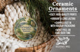 Ceramic ornaments, featuring a painting of a scenic view of Wilmington State Parks, Delaware, hanging in a woven basket.