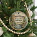 A round ornament hanging on a Christmas tree, featuring a scenic image of the Yampa River State Park in Colorado.