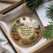 A decorative ornament with a vintage-style illustration of a trolley car, palm trees, and a woman in a red dress, along with the text "Ybor City Museum State Park, Florida".