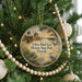 A round ornament hanging on a Christmas tree, featuring a scenic image of the Yellow Bluff Fort Historic State Park in Florida.