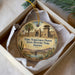 A decorative ornament in a box, featuring an illustration of Yuma Territorial Prison State Historic Park, Arizona.