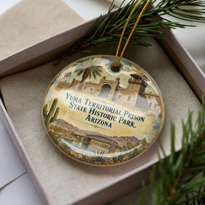 A decorative ornament in a box, featuring an illustration of Yuma Territorial Prison State Historic Park, Arizona.