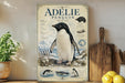 a poster of an Adelie penguin on a shelf, with a wooden cutting board and some lemons nearby.
