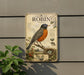 a vintage-style metal sign with an illustration of a robin, mounted on a wall.