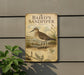 a sign for the Baird's Sandpiper, a bird that is native to the coastal regions of North America.