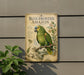 a vintage-style metal sign with a colorful illustration of a blue-fronted Amazon parrot perched on a branch.