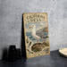 A vintage-style metal plate with an illustration of a seagull standing on a rock, surrounded by various bird-related elements, such as a bird's nest and a bird's wing.