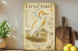 a large illustration of a white heron standing in a grassy field, with various birds and animals in the background.