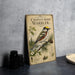 a vintage-style book or magazine cover with a detailed illustration of a bird, specifically a chestnut-sided warbler, perched on a branch with pine cones. The cover also includes text and illustrations related to the bird, such as its habitat, size, and other characteristics.