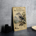 A vintage-style metal sign titled " Clark's Nutcracker" featuring an illustration of a bird perched on a tree branch with pine cones and mountains in the background.