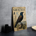 a vintage-style magazine cover titled "Common Crackle" with an illustration of a bird perched on a rock. The cover also includes text and illustrations related to the bird, such as its name, scientific name, and habitat.