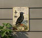 a metal plaque with an illustration of a crested auklet, a type of seabird, mounted on a wall.
