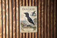 a vintage-style poster of a dove perched on a rock, with a coastal background.