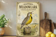 a vintage-style poster of a yellow bird perched on a wooden post, surrounded by a pastoral scene.