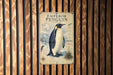 a poster of an Emperor Penguin, which is a large penguin standing on a snowy surface.