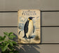 a penguin on a sign with various texts and illustrations, including a map and a compass rose.