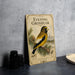 a vintage-style book cover with a yellow and black bird perched on a pine branch, surrounded by pine cones and a mountain landscape.