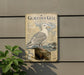a sign for the Glaucous Gull, a large seabird, with a detailed illustration of the bird and its natural habitat.