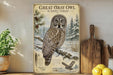 A framed illustration of a great gray owl in a snowy forest, accompanied by text and a detailed illustration of the owl's features.