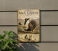 a metal sign with an illustration of a Greater Sage-Grouse, a species of bird, mounted on a wall.