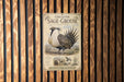 a vintage-style metal sign with an illustration of a Greater Sage-Grouse, a bird species native to North America.