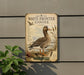 a sign with a detailed illustration of a white-fronted goose, surrounded by various elements such as plants and a mountain backdrop.