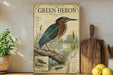 A vintage-style field guide for the Green Heron, featuring illustrations and text about the bird's natural habitat, behavior, and conservation status.