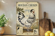 a poster of a Houdan chicken, which is a breed of chicken known for its distinctive appearance and behavior. The poster is displayed on a shelf next to a wooden cutting board and a potted plant.