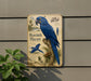 a blue parrot, specifically the Hyacinth Macaw, perched on a branch.
