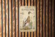 a sign for the Indian Runner Duck, which is mounted on a wooden wall.
