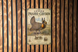 A vintage-style poster of a prairie chicken is displayed on a wooden wall.