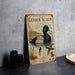 A vintage-style illustration of a Lesser Scaup, a type of waterfowl, with detailed illustrations of the bird in its natural habitat.
