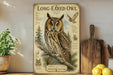 a framed illustration of a long-eared owl, a type of owl, with various text and illustrations related to the owl's characteristics and habitat.