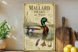 A vintage-style metal sign displaying an illustration of Mallard ducks swimming on water, with text describing the species.