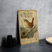 A vintage metal sign featuring a detailed illustration of a marsh wren, with text describing the bird and its habitat.
