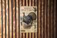 A vintage-style poster of a turkey is displayed on a wooden wall, featuring detailed illustrations and text.