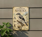 a vintage-style metal sign with illustrations and text, mounted on a wall next to a plant.