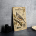 a metal sign with an illustration of an oak titmouse perched on a branch, accompanied by various bird-related illustrations and text.