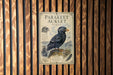a poster of a parakeet, which is a type of small, colorful bird, displayed on a wooden wall.